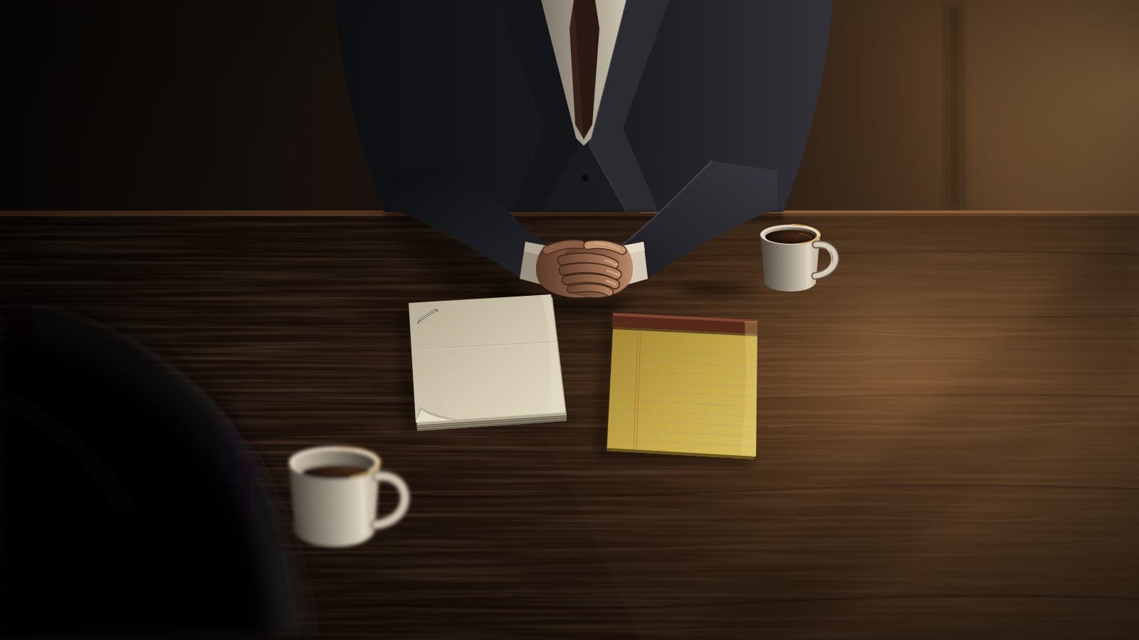 Over-the-shoulder view of a dark wooden consultation table with two coffee cups, a blank legal pad and a closed stapled packet of papers, with an attorney's clasped hands across the table in soft window light.